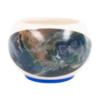 A ceramic mug with NASA heat change shape and embossed details. Hot image