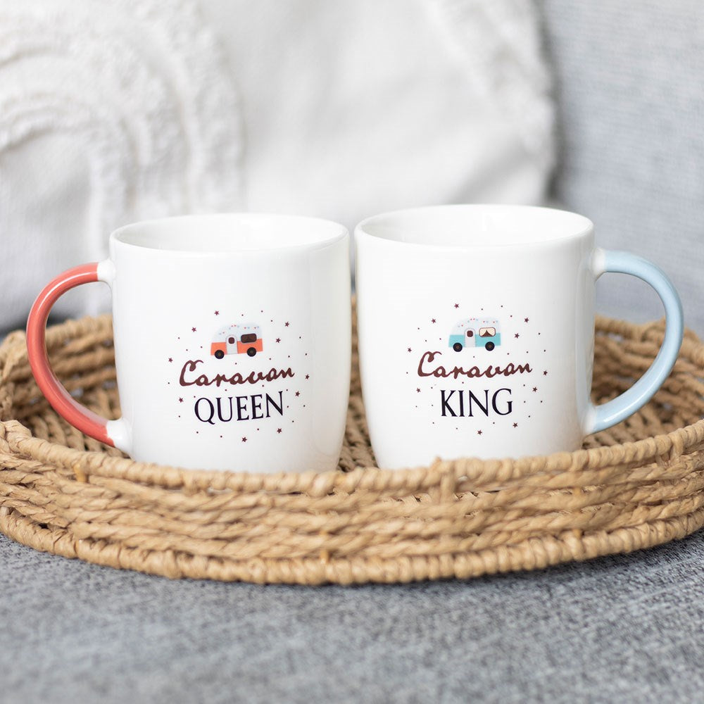 Two mugs labelled 'Caravan Queen' and 'Caravan King' with coloured handles