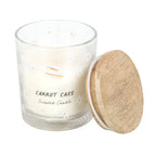 Carrot cake scented candle with wooden lid on a white background