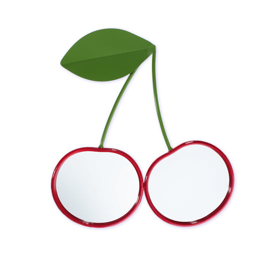 Decorative mirror shaped like a cherry with red circles and green stem on a white background