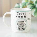 Mug with 'Crazy cat lady' text and a cat illustration on a white background