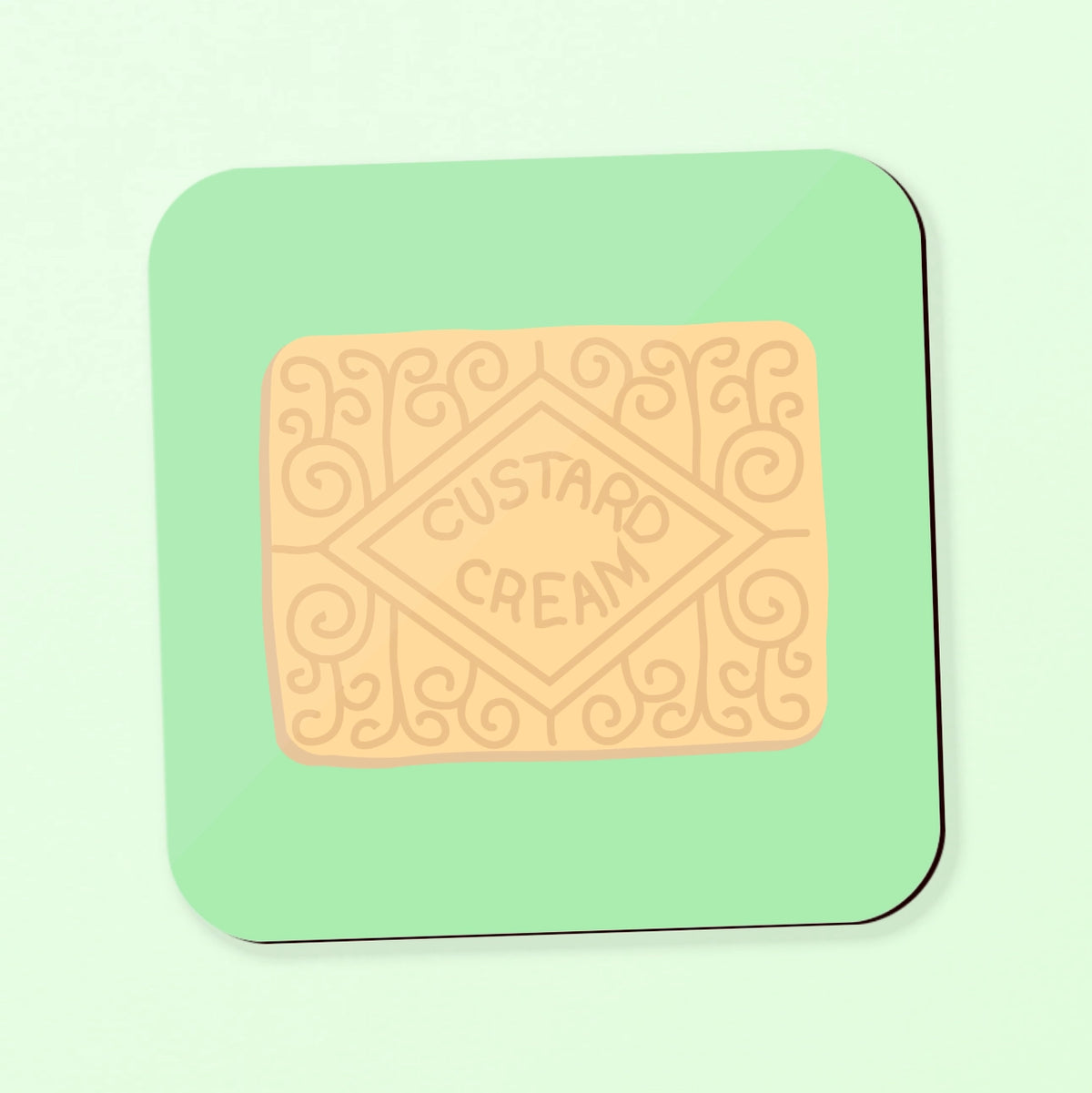 A square coaster featuring a custard cream biscuit on a green background