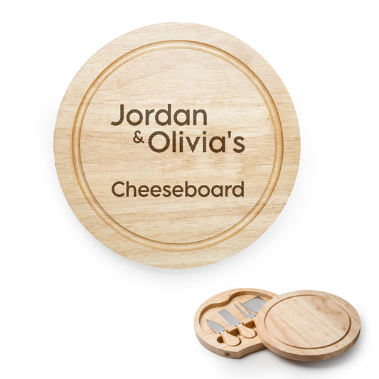 Wooden cheeseboard set with 'Jordan & Olivia's Cheeseboard' engraving on a white background