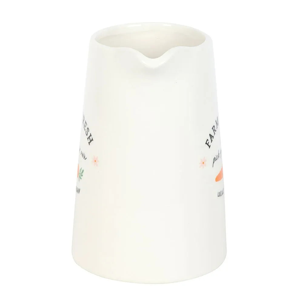 White ceramic vase with text and illustrations on a white background