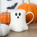 a clear glass mug shaped like a ghost
