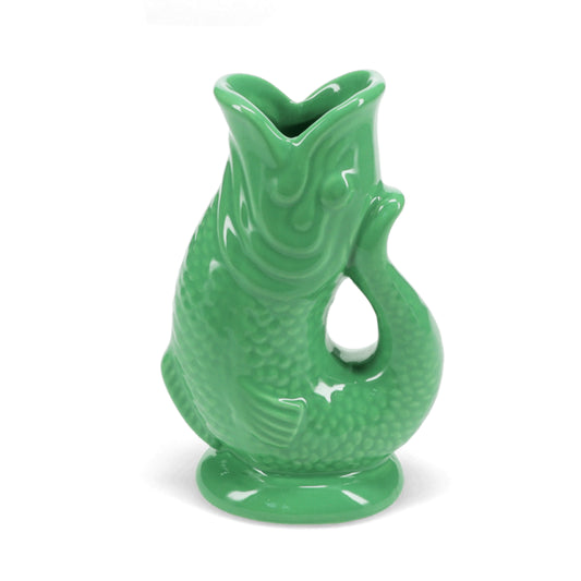 Green fish-shaped vase on a white background