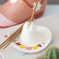Incense stick holder shaped like a cowboy hat with 'HOWDY' text on a light background