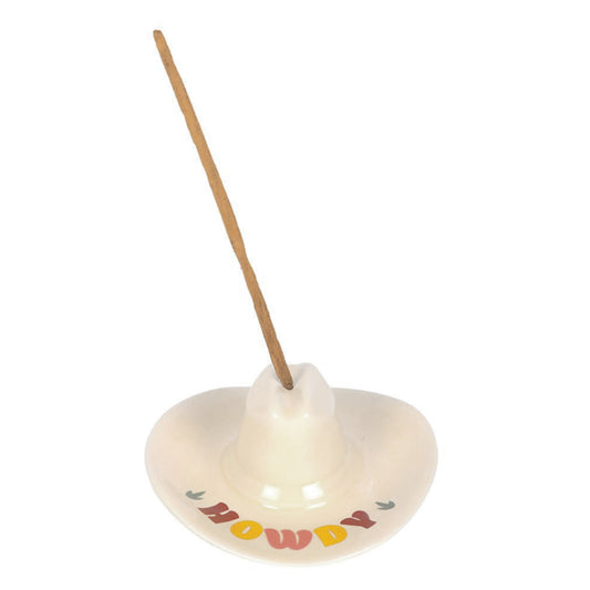 cowboy hat shaped Incense holder with 'Howdy' text and a wooden incense stick on a white background