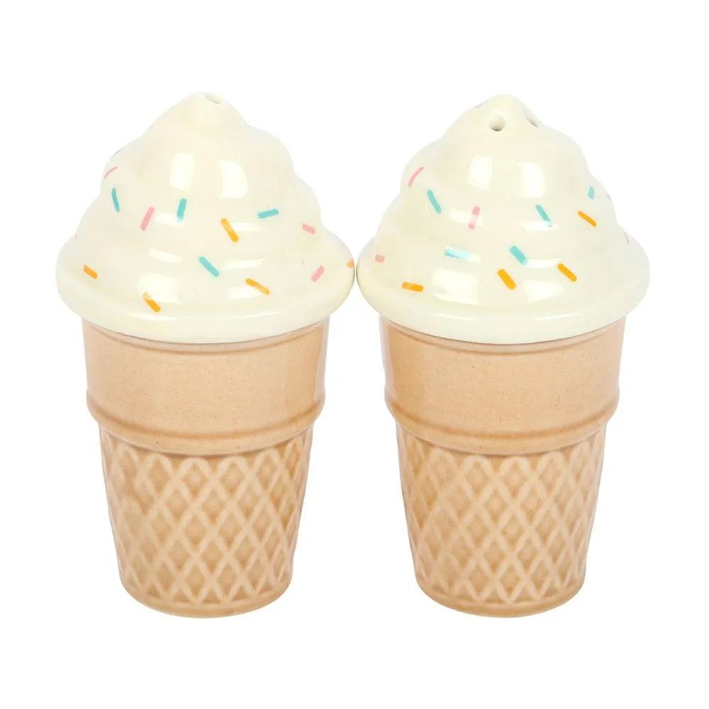 Two ice cream cone-shaped salt and pepper shakers with colorful sprinkles on a white background.