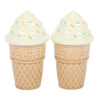 Two ice cream cone-shaped salt and pepper shakers with sprinkles on a white background