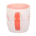 White mug with pink interior and handle on a white background