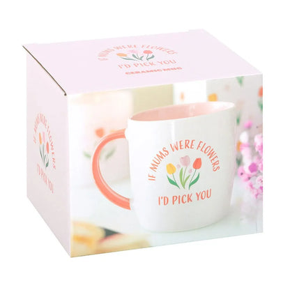 Mug with floral design and text in a decorative box on a white background