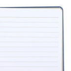 Close-up of a lined notebook page with a blue border.