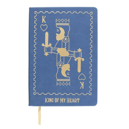 Blue notebook with gold illustration of a king and 'King of My Heart' text on a white background