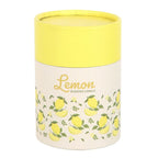 Cylindrical candle container with lemon design and yellow lid on a white background