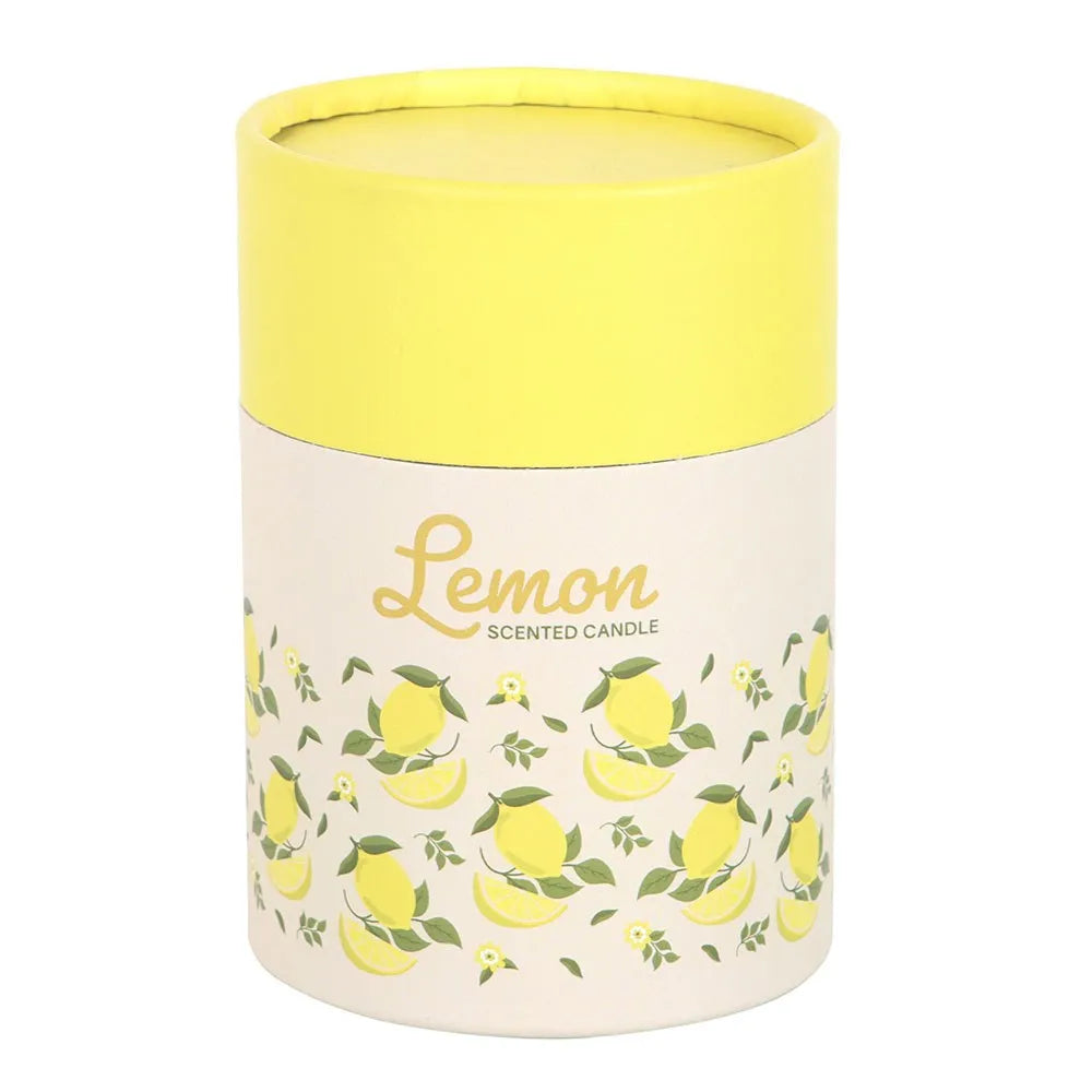Cylindrical candle container with lemon design and yellow lid on a white background