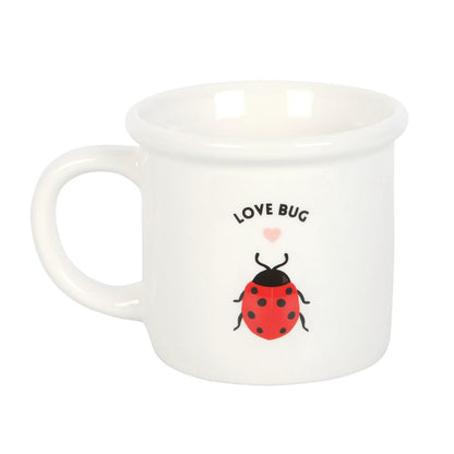 White mug with a red ladybug or ladybird and 'LOVE BUG' text on a white background