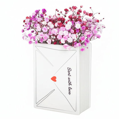White envelope-shaped box with pink and red flowers, 'Sent with love' text, and a red heart on a white background.