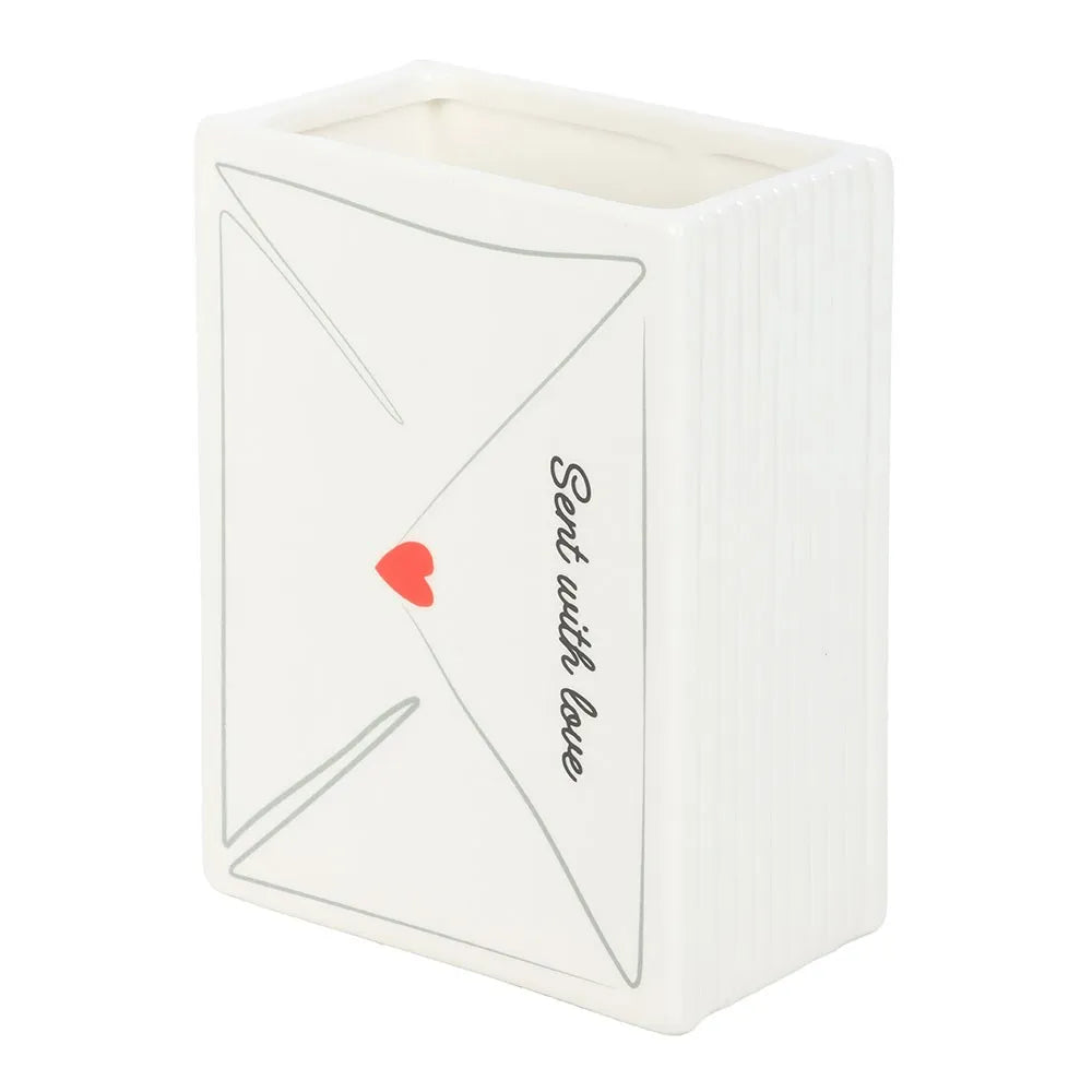 White vase shaped like an envelope with a red heart and 'Sent with love' text on a white background
