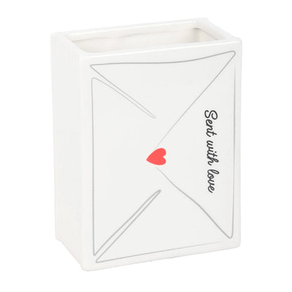 ceramic white vase shaped like an envelope with a red heart and 'Sent with love' text on a white background
