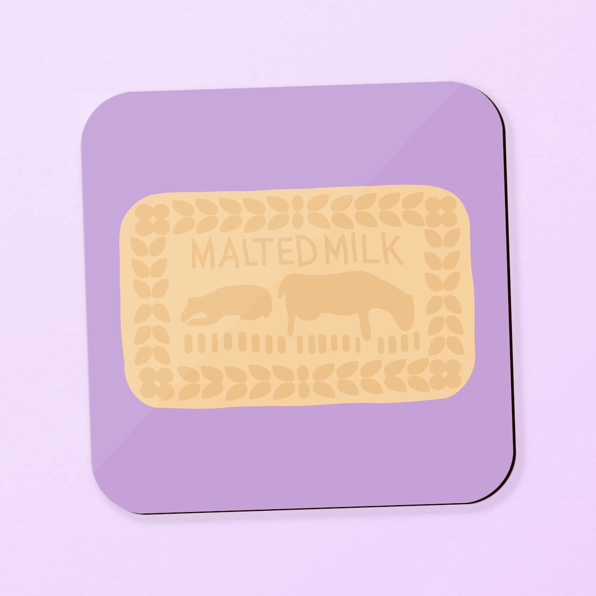 A square coaster featuring a malted milk biscuit on a purple background