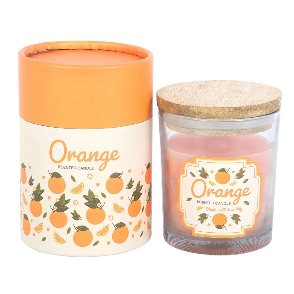 Orange scented candle with a wooden lid with packaging on a white background