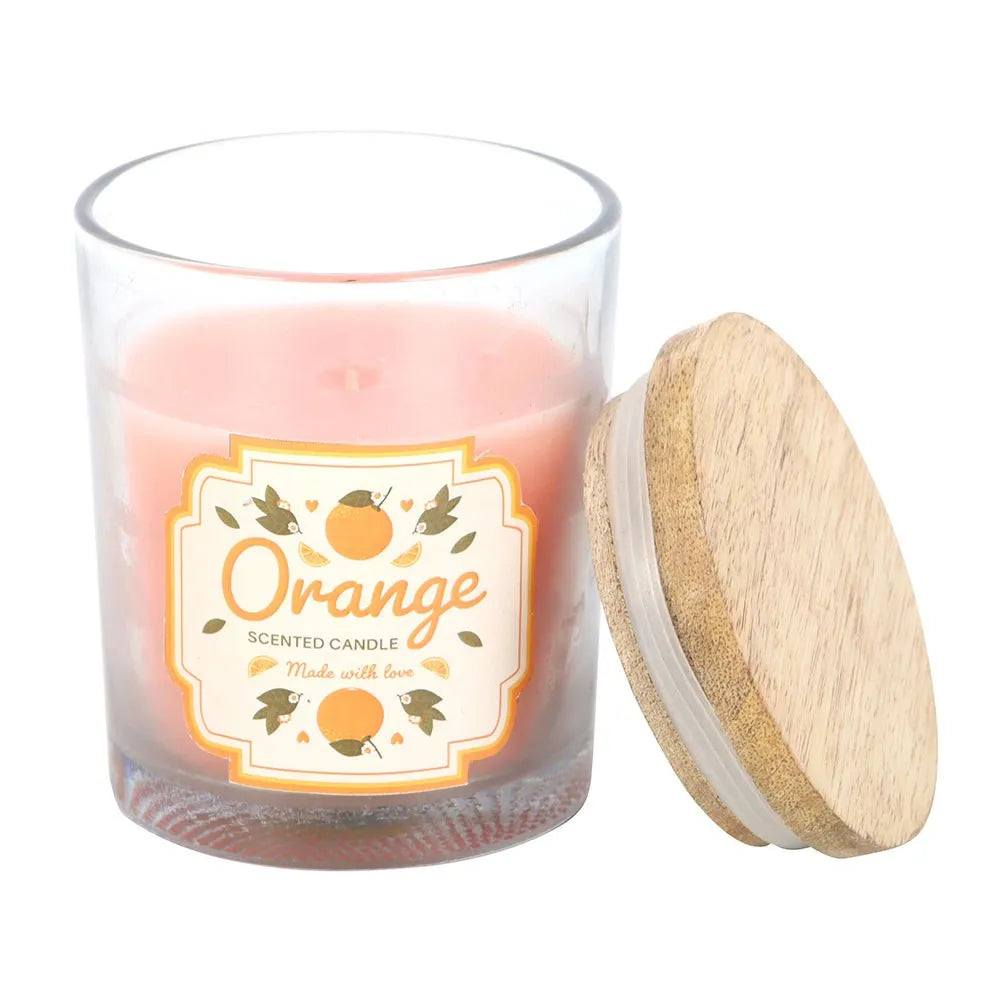 Glass candle with wooden lid labeled 'Orange Scented Candle' on a white background