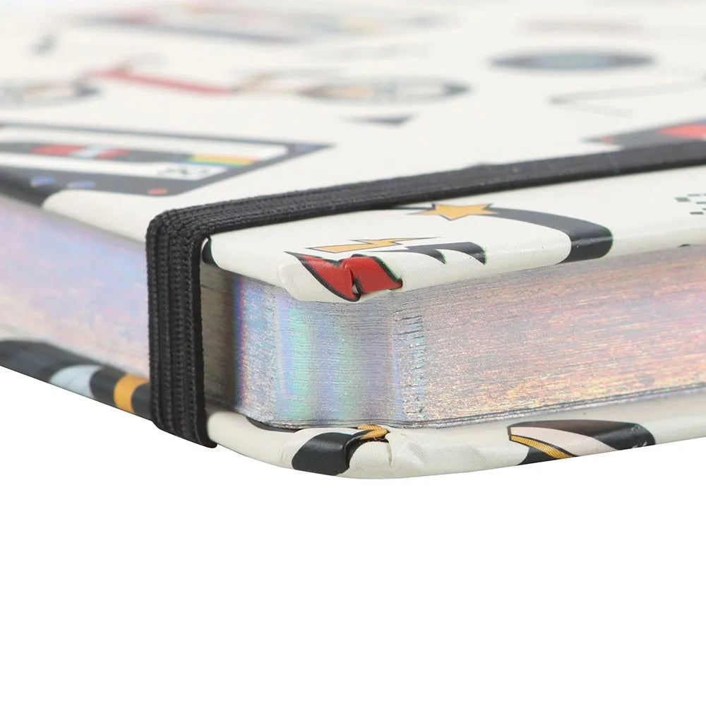 Close-up of notebook pages with silver edging with a colourful design on a white background