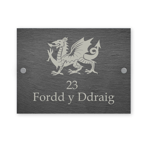 Rectangle slate house sign with illustration of a Welsh dragon and house number and street