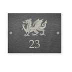 Rectangle slate house sign with illustration of a Welsh dragon and house number and street