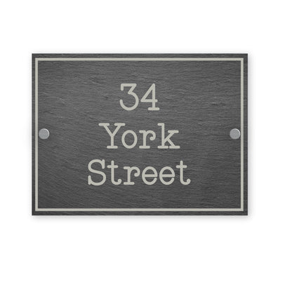 Gray rectangular house number sign with '34 York Street' text on a white background