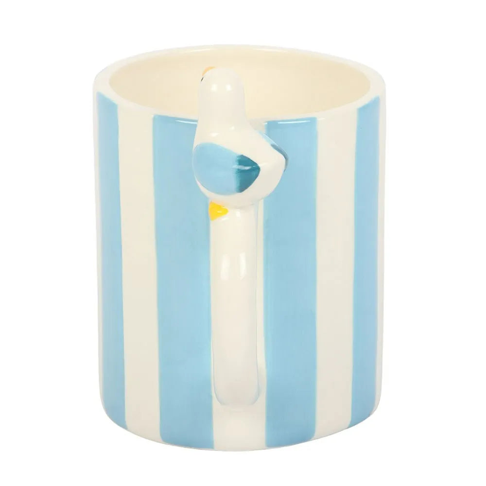 Ceramic mug with blue and white stripes and a swan design on a white background