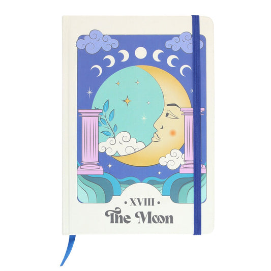 Notebook with celestial design and 'The Moon' tarot card illustration on a white background