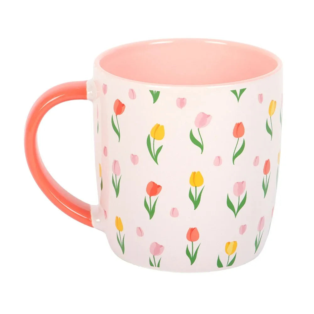 Mug with floral pattern and pink interior on a white background