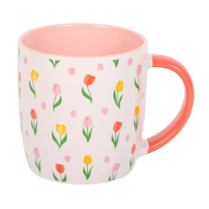 Mug with floral pattern and pink interior on a white background