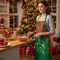 Woman in a kitchen wearing a green apron with a Christmas tree in the background