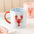 Mug with red lobster design and 'You are my lobster' text on a light background